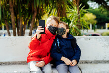 Children Taking A Picture With Their Smartphone