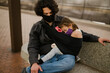 © Cavan Images - daughter sleeping in sling on dad wearing face masks