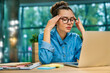 © InsideCreativeHouse - Exhausted stressed young businesswoman trying to concentrate in front of laptop in cosy office