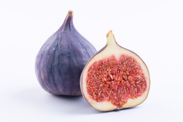 Wall Mural - Ripe purple raw figs isolated on white background, whole and cut in half