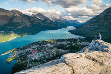 Hiker Watching The Sunset Over Waterton National Park In Alberta