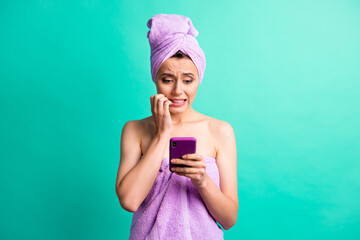 Wall Mural - Photo of terrified lady bite fingers nails hold telephone wear violet towels shower isolated teal color background