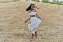 Photo Session Of A Beautiful Black Woman In A Wheat Field With A White Dress