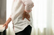 © Cavan Images - Old woman back pain at home, health problem concept
