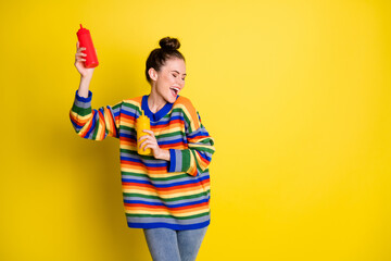 Sticker - Photo of brown bun haired pretty girl hold ketchup mustard dancer copyspace closed eyes isolated on vivid color background