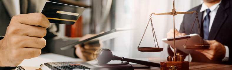 Business and lawyers discussing contract papers with brass scale on desk in office. Law, legal services, advice, justice and law concept picture with film grain effect