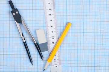 Wall Mural - Still life photo of engineering graph paper with a fine 0.1mm pen, compass and ruler, blank to add your own design, image or text.