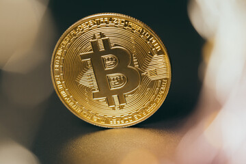 Wall Mural - Bitcoins and new virtual money. Gold coin with B.Mining icon or blockchain technology