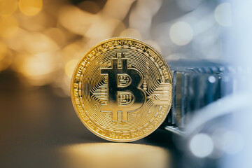Wall Mural - Bitcoins and new virtual money. Gold coin with B.Mining icon or blockchain technology