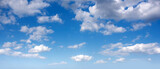 Fototapeta  - Panorama of afternoon blue sky with white clouds.