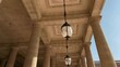 Footage of hung lamps and columns at a palace called 