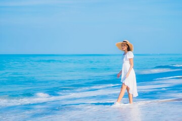 Portrait beautiful young asian woman relax smile leisure around sea beach ocean