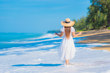 Portrait beautiful young asian woman relax smile leisure around sea beach ocean