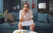 © StockPhotoPro - Shocked woman checking her bills