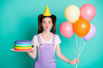 Sticker - Photo of romantic girl hold balloons striped cake lips blow air kiss wear violet overall paper cone cap isolated teal color background