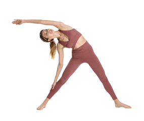 Wall Mural - Young woman in sportswear practicing yoga on white background