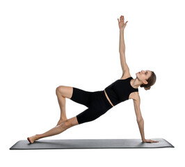 Wall Mural - Young woman in sportswear practicing yoga on white background