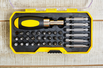 screwdriver and nozzles in a plastic box, copy place, screwdriver nozzles