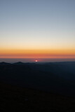 Fototapeta Niebo - Sunrise in mountains