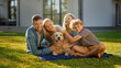 © Gorodenkoff - Portrait of Father, Mother and Son Having Picnic on the Lawn, Posing with Happy Golden Retriever Dog. Idyllic Family Have Fun with Loyal Pedigree Dog Outdoors in Summer House Backyard.