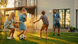 Leinwandbild Motiv Happy Family of Four Playing with Garden Water Hose, Spraying Each Other. Mother, Father, Daughter and Son Have Fun Playing Games in the Backyard Lawn of Idyllic Suburban House on Sunny Summer Day