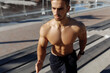 © Shopping King Louie - Athletic muscular shirtless man working out outdoors, sport, motivation