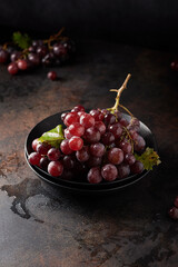 Poster - Red grapes on the black table