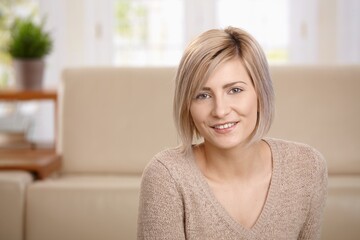 Wall Mural - Portrait of young woman at home