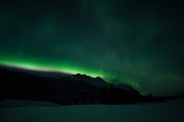 aurora over alaska mountains