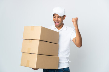 Delivery Brazilian man isolated on white background celebrating a victory