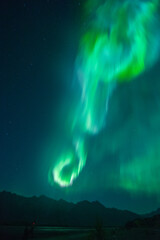 aurora over knik river in alaska.