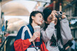© Pansfun Images/Stocksy - Two asian female friends traveling together in the city