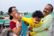 © saptak Ganguly/Stocksy - Baby girl having fun with her grandparents,family love
