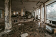 © Chris Zielecki/Stocksy - Interior of abandoned building with wet floor