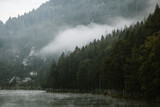 Fototapeta Sypialnia - Foggy early morning on the mountain lake