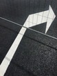 © Amsterdam/Stocksy - arrow on asphalt