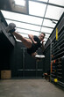 © Chris Zielecki/Stocksy - Strong male athlete kicking air during training