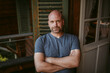 © Chris Zielecki/Stocksy - Confident mature man sitting with crossed hands