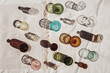 © Weekend Creative/Stocksy - Colorful Glass Cups, Bottles, and Jars on Canvas Cloth