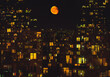 © Ivan Andrianov/Stocksy - yellow moon over the city