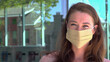 Young professional woman wearing COVID mask 4k