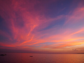 Wall Mural - Amazing and beautiful sunsets, Dusk sky in the evening, Beautifully shaped clouds in the sky, The sky is changing to a purple color, Malapascua Island, Daanbantayan, Philippines