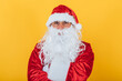 © Davidbenito - Portrait of Santa Claus on yellow background. Christmas concept