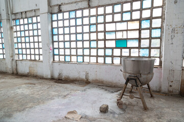 Sticker - Square windows and a kettle inside an old abandoned industrial building