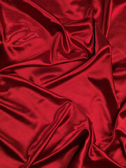 Red shiny silky satin fabric background texture