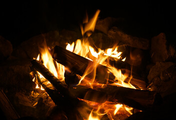 burning firewood and camp fire at night