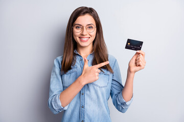 Wall Mural - Portrait of attractive positive person direct finger debit card great offer isolated on grey color background
