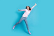 © deagreez - Full length photo of excited careless girl jump enjoy crazy funky weekend raise hands wear lilac pullover isolated over blue color background