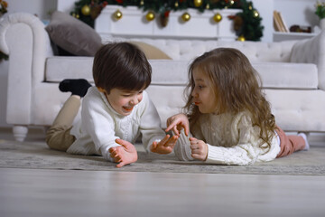 A young family with children decorates the house for the holiday. New Years Eve. Waiting for the new year.