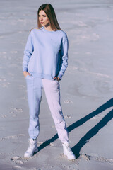 Wall Mural - Fashion woman wearing white clothes outdoor on the beach